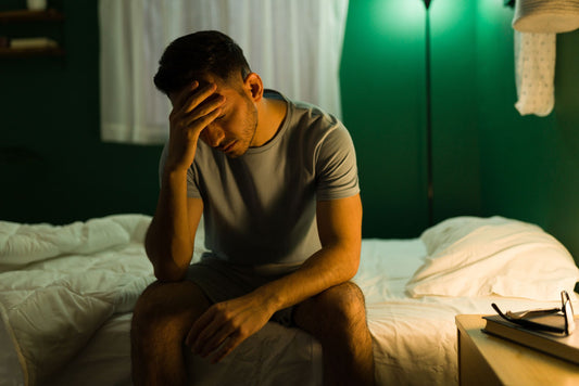 Man just woken tired from bad sleep quality